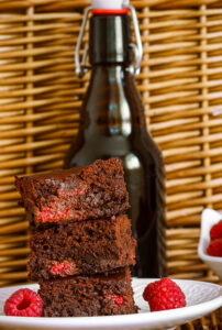 Beer with chocolate cake and raspberries