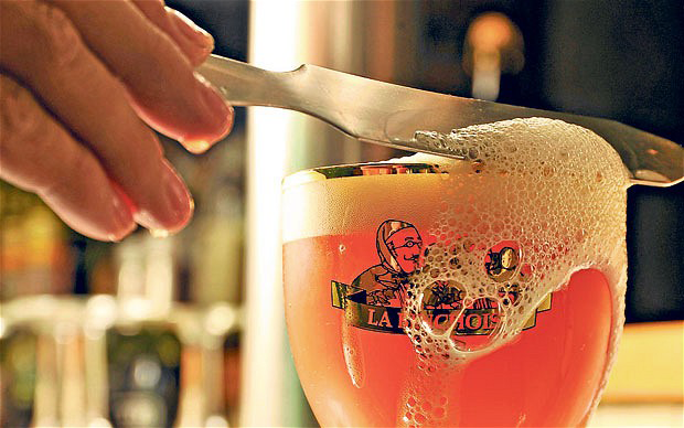 Belgian Beer With Head Being Cut