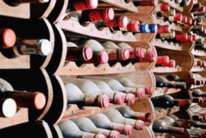 aging wine bottles in rack