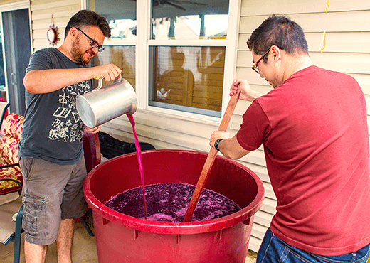 Adding Wine Making Ingredients To A Batch Of Wine.