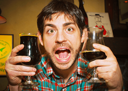 Man Holding Two Glasses Of Ninkasi Brewing Double Latte