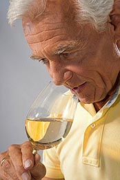 Man Smelling Homemade Wine