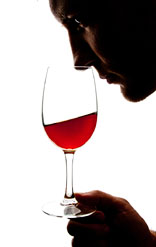 filtered wine in a glass being smelled by a person