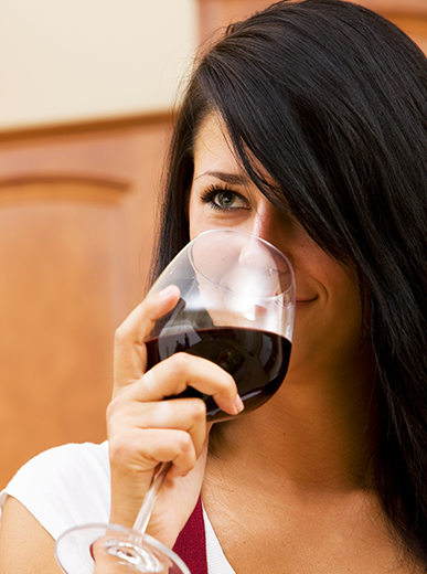 Woman Sampling Homemade Wine